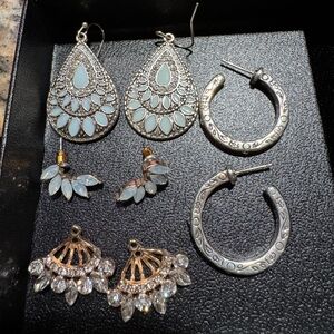 Silver earrings. Four pairs. Elegant and sparkly